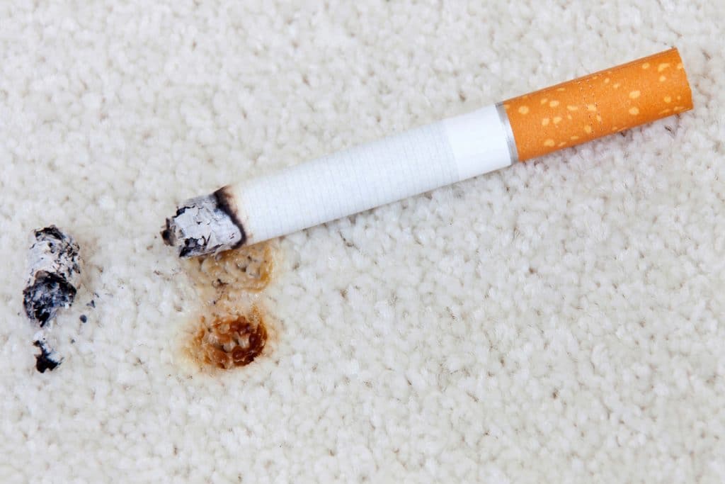 Cigarette burn on the carpet
