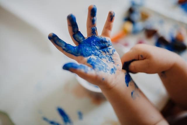 painting-kid-hand-carpet-cleaning