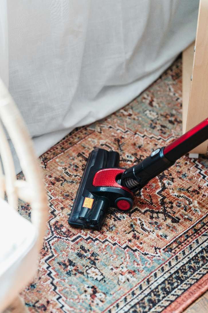 A picture of a person doing professional area rug cleaning