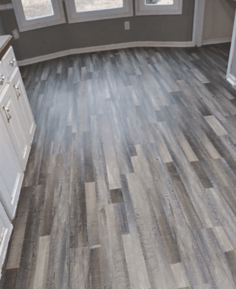 Luxury vinyl plank installed in a room.