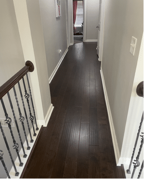 Hardwood floor refinishing by Carpet & Flooring Transformers