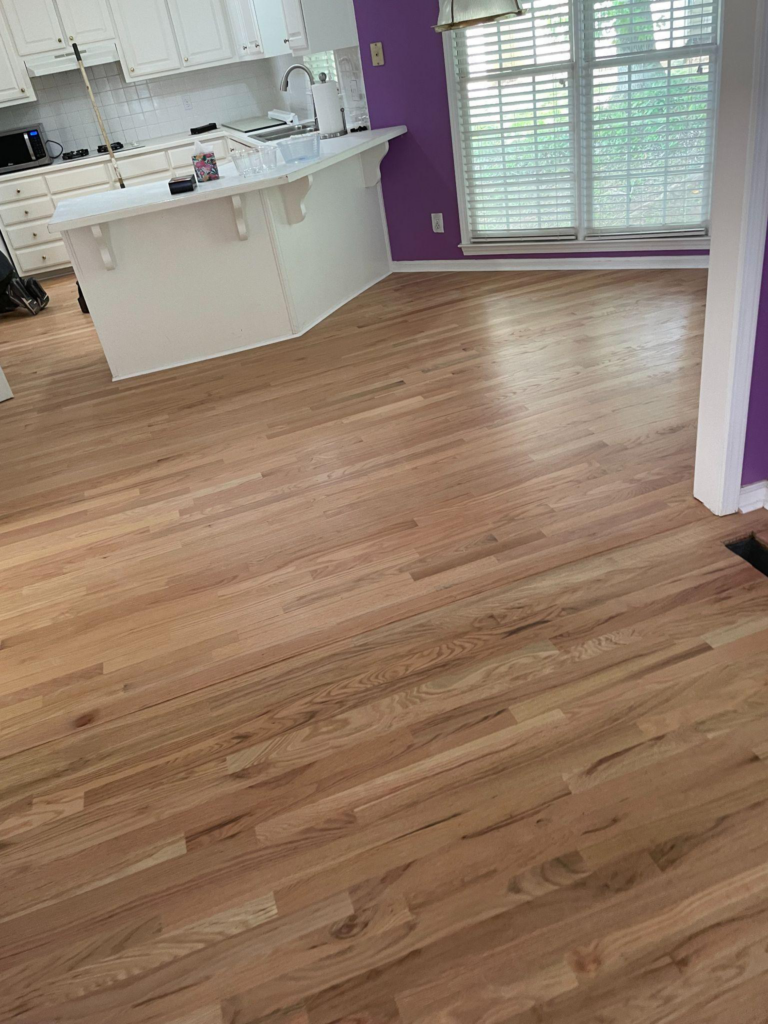 This photo shows an empty room with smooth flooring